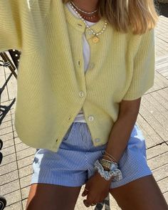 Butter yellow is the trendiest color to add to your spring and summer outfits this season, and we just love this casual outfit with a short pale yellow cardigan and blue striped shorts! Check out our article for more styling ideas and inspiration. Striped Short Outfits, Shorts Outfit Women Summer, Color Fits, Outfit Outfit Ideas, Striped Shorts Outfits, Yellow Short Outfit, Pale Yellow Sweater Outfit, Yellow Cardigan Outfit Spring, Yellow Shorts Outfit Summer