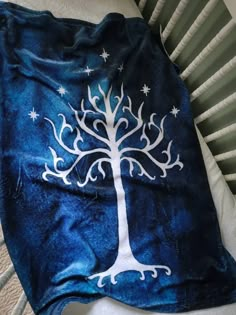 a blanket that has a tree on it