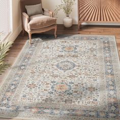 a living room with a chair and rug on the floor