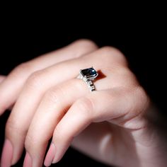 a woman's hand with a ring on it