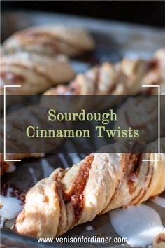 sourdough cinnamon twists on a baking sheet with icing