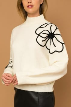 Add a touch of timeless elegance to your winter wardrobe with our Flower Embroidery Mock Neck Sweater. This exquisite piece combines classic charm with contemporary style, featuring intricate flower embroidery that lends an air of sophistication to any outfit. The cozy mock neck not only keeps you warm but also elevates the sweater's chic appeal. Crafted from high-quality and luxuriously soft fabric, this sweater delivers both comfort and fashion. With its ribbed cuffs and hem, it offers a snug Flower Silhouette, Romper And Jacket, Sweater Fits, Chic Sweaters, Knitted Coat, Embroidered Sweater, Sweater Vintage, Mock Neckline, Sweaters Online