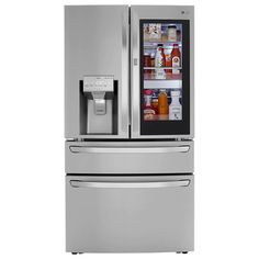 a silver refrigerator with its door open and the freezer is shown in front of it