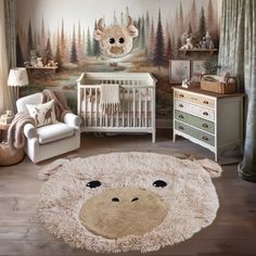 a baby's room with a teddy bear rug on the floor