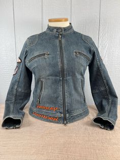 Description: Vintage Fitted Size(L) Women's Embroidered Blue Denim(99%Cotton/1%Spandex) Harley Davidson Branded Jacket | Size L Jacket is branded with Harley Davidson. Buttons/Zippers are all branded with Harley Davidson. Patches/Embroidery are Harley Davidson Branded Manufacturer: Harley Davidson, Made In Macau Product Size: Fitted Women's Large Product Weight: Approx: 3 lbs Condition: Very good vintage condition. Like new Items in our shop are vintage and are not brand new. Most items come from estate sales, auctions, or private collections. The items may show minor age related wear and/or minor flaws consistent with the date of manufacture(please be sure to check photos carefully as they are part of the description). While we do our best to describe any imperfections, we are not experts Branded Jacket, Harley Davidson Patches, Patches Embroidery, Vintage Denim Jacket, Vintage Fits, Fit Ideas, Estate Sales, Fit Inspo, Vintage Denim