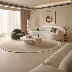 a living room filled with white furniture and lots of windows