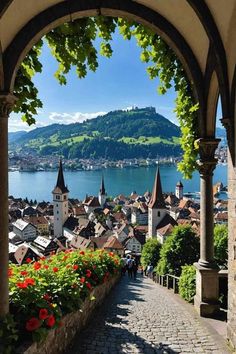 an arch leading to a scenic view of a town