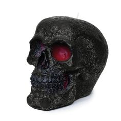 a black skull with red eyes on a white background