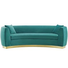 a blue couch with gold trim and pillows on it's back, in front of a white background