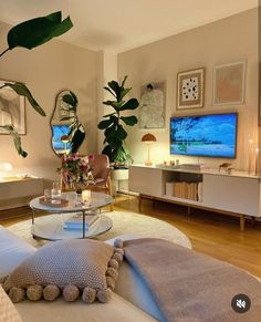 a living room filled with furniture and a flat screen tv