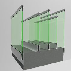 three glass partitions on the side of a wall with metal bars in front of them