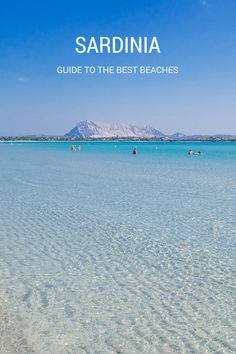 the beach is clear and blue with people in it