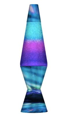 a tall glass vase sitting on top of a white table covered in blue and purple liquid