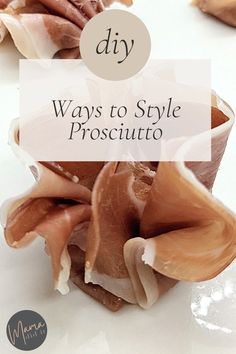 some food that is sitting on top of a white surface with the words diy ways to style prosciutto