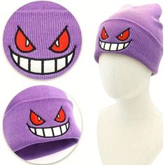 a purple beanie hat with red eyes and fangs