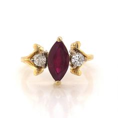 Marquise Cut Ruby Engagement Ring in 18k Yellow Gold Gold Marquise Cut Ruby Diamond Ring, Classic Ruby Ring With Marquise Cut And Prong Setting, Marquise Ruby Ring With Center Stone, Formal Ruby Three Stone Ring, Formal Red Ruby Ring With Three Stones, Formal Red Three Stone Ruby Ring, Ruby Ring With Center Stone In Marquise Cut, Ruby Ring With Marquise Cut And Center Stone, Marquise Cut Ruby Diamond Ring