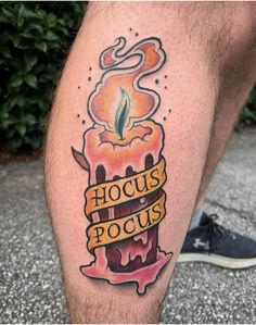 a man's leg with a tattoo on it that says hoccus pocus