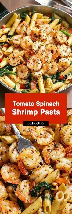 a pan filled with shrimp pasta and spinach