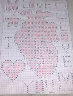 a cross - stitch pattern is displayed on a white tablecloth with red and black dots