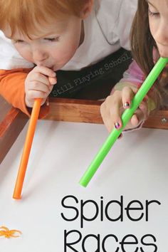 two young children are playing with their green and orange toothbrushes on the table