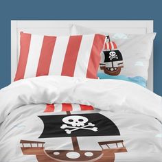 a bed with a pirate ship on it