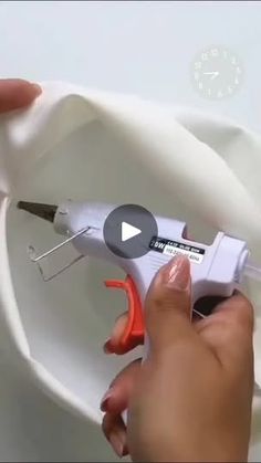 a person is using scissors to cut fabric