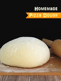 a ball of dough sitting on top of a wooden cutting board next to rolling pin