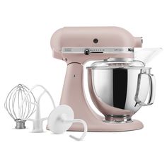 an image of a pink mixer with attachments