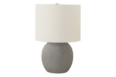 a gray table lamp with a white shade