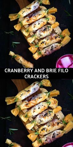 cranberry and brie filled crackers with rosemary garnish on top