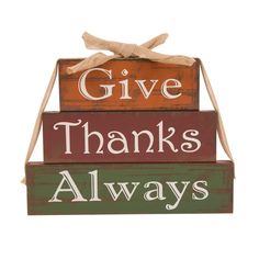 a wooden sign that says give thanks, thanks and always with a bow on top