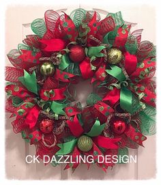 a christmas wreath with red and green decorations