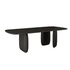 a black table sitting on top of a white wall