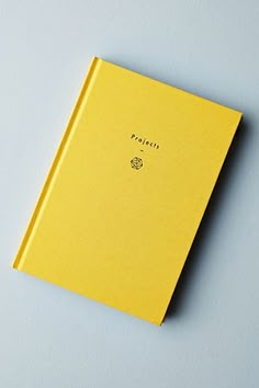 a yellow book sitting on top of a table