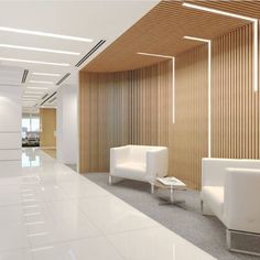 an office lobby with white chairs and wooden partitions