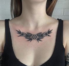 a woman with a black and white tattoo on her chest