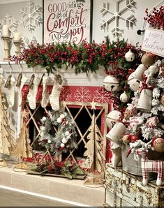 a fireplace decorated for christmas with stockings and wreaths