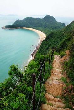 stairs lead down to the beach and ocean