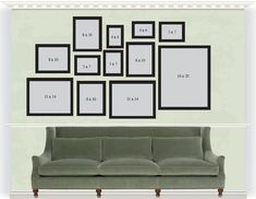 a living room with a green couch and several black frames on the wall above it