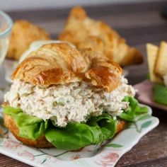 a croissant sandwich with chicken salad on it