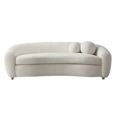 a white couch with two pillows on it's back and one arm extended to the side