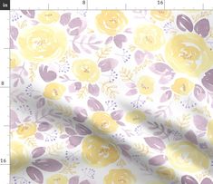 yellow and blue flowers on white background with ruler in the foreground for size measurement