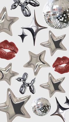 many shiny objects are grouped together in the shape of stars and kiss - shaped lips