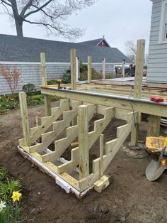 a wooden structure being built in the yard