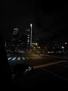 the city lights shine brightly in the dark