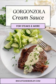 a white plate topped with steak and cucumbers next to a fork on a table