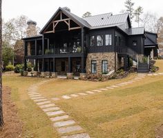 a large house with stone steps leading up to it