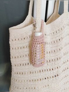 a crocheted bag hanging from a hook