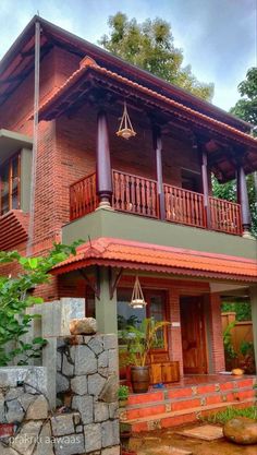 a red brick house with wooden balconies