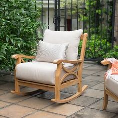 a rocking chair and ottoman on a patio